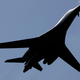 A United States Air Force B-1B bomber flies over during a flight display at the Farnborough aerospace show, in Farnborough, England, Tuesday July 15, 2008. The world’s largest air show opened Monday with several new orders and aerospace executives upbeat about the future of the industry despite high fuel prices and the credit crisis. The Farnborough International Airshow on the outskirts of London is traditionally _ along with its sister show in Le Bourget in France on alternate years _ the scene of a flurry of high profile orders for U.S-based Boeing Co. and its European rival Airbus. (AP Photo/Lefteris Pitarakis)